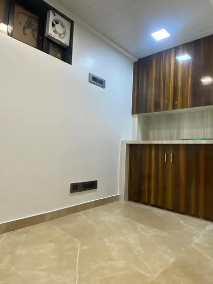 This image shows the custom cabinetry and storage unit I built for the office. The dual-tone wood laminate finish adds warmth to the space, providing essential storage without compromising on design. Every piece of furniture is built to fit the specific layout and needs of the client.