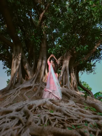A dramatic portrait using the magnificent roots of a banyan tree as a natural throne. I love finding creative ways to use nature to create powerful and unique images.