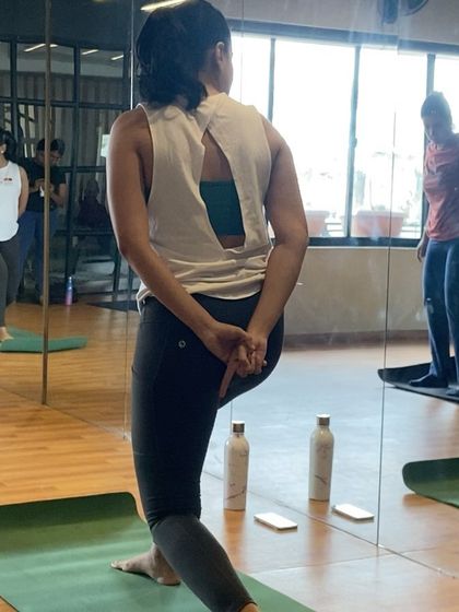 A student holding a stretch that opens up the chest and shoulders. Flexibility and mobility are just as important as strength in my classes.