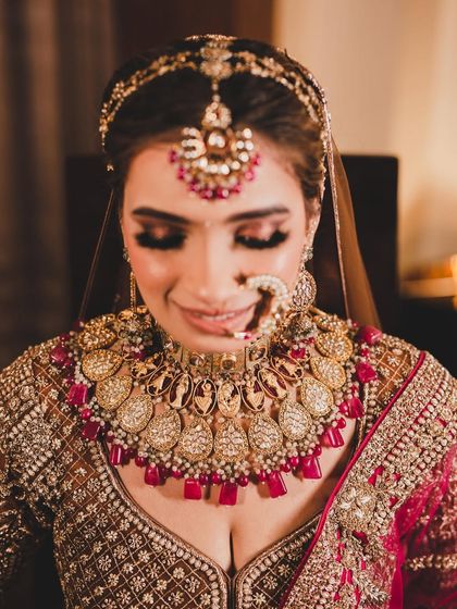 A smiling portrait of the bride, looking happy and confident on her big day.