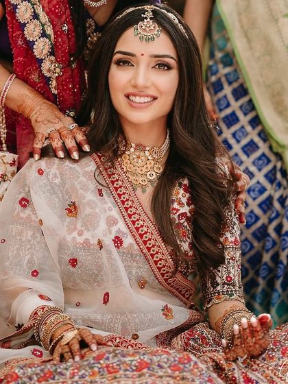 A beautiful look for a Mandap Mahurrat ceremony. The makeup is traditional yet fresh, with a focus on clean skin and defined eyes.