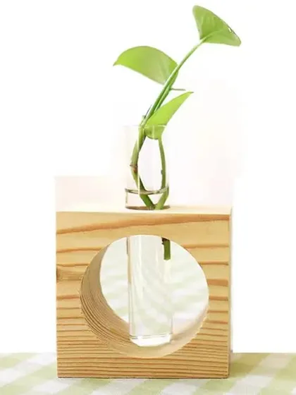 Another style of my wooden test tube planters, this one features a single tube in a solid wood block with a circular cutout. It's a simple yet elegant piece for any modern desk.