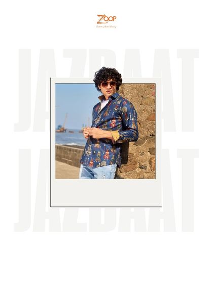 This printed shirt from the Jazbaat collection, shown against a seaside backdrop, offers a seamless blend of comfort, sophistication, and artistic expression.