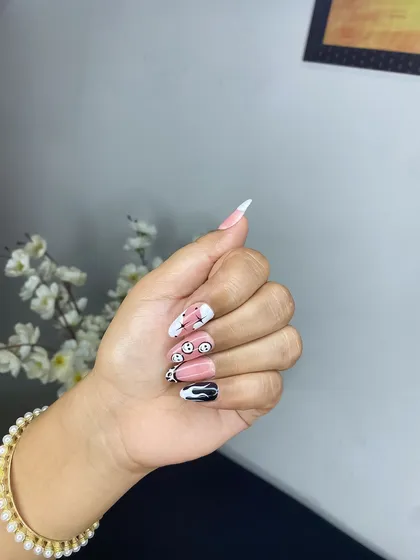 Fun and creative nail art by a student from my May batch, featuring smiley faces and drip effects. My courses empower students to express their own unique style.