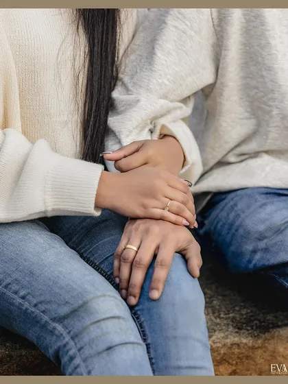 A close-up on the hands and rings, symbolizing the commitment and connection at the heart of Amrutha and Varun's pre-wedding story.