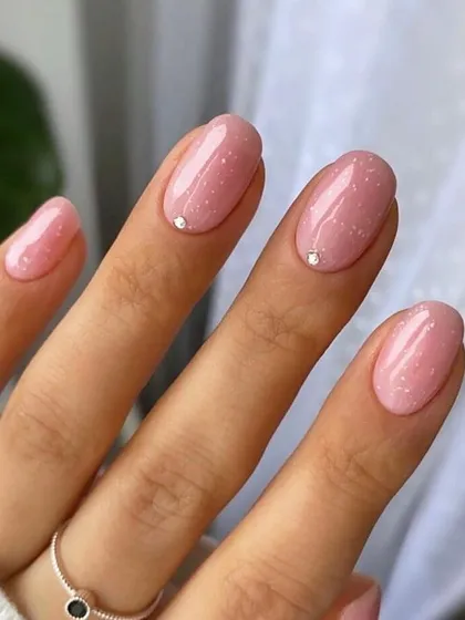 A simple yet elegant design using a semi-transparent glitter gel polish. This technique is perfect for clients who want a subtle sparkle, and you'll learn how to apply it for a flawless, even finish.