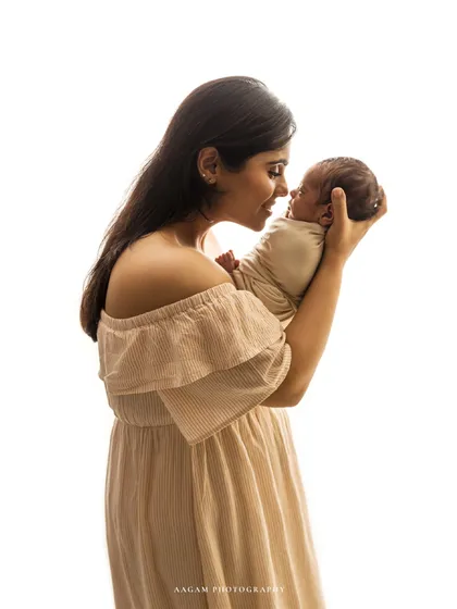 A portrait of just mom and baby from the same session, capturing her joyful expression.