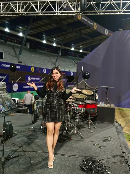 On the big stage at the stadium, with my arms wide open, ready to welcome the audience's energy.