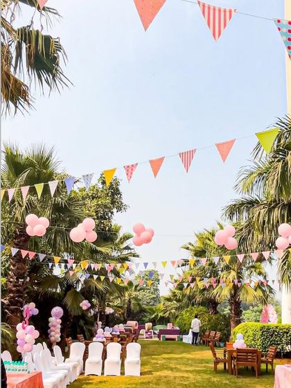 A view of the princess party from above, showing the festive bunting strung between palm trees. This demonstrates how I utilize the entire space to create an immersive atmosphere.
