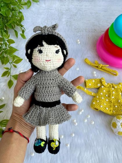This special project was to recreate a little girl's first birthday outfits on her own mini replica doll. The doll comes with two removable dresses and accessories, making it a beautiful toy and a cherished memory keeper.