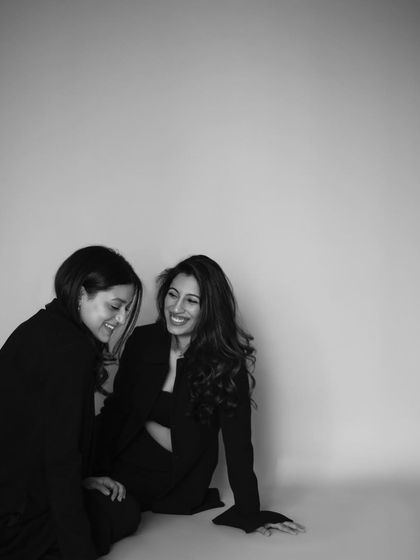 Another moment of connection between Amira and Anahita. Their shared smile and easy posture show the comfort and trust between them.