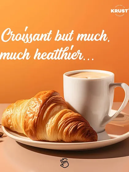 A classic, buttery croissant paired with a perfectly brewed coffee. This image captures the essence of a perfect morning break at my café, highlighting our commitment to authentic French viennoiserie.