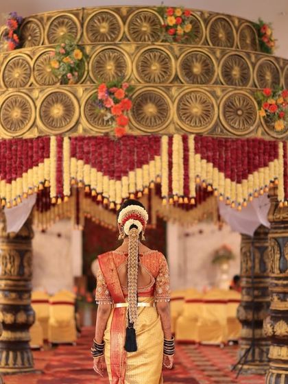 A stunning back shot of our bride Sahana, showcasing the intricate 'Jade Bangara' (hair braid ornament) that perfectly matches her temple jewellery set.