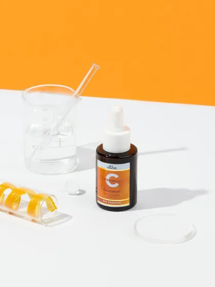 A lab-inspired setup for a Vitamin C serum. Using beakers and test tubes gives the product a sense of scientific credibility, while the pop of orange keeps it feeling fresh and vibrant.