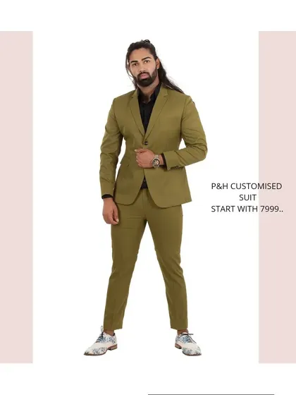 An olive green two-piece suit, offering a modern and stylish color choice for the fashion-conscious man.