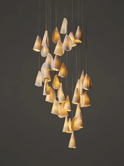 A cascading spiral of Bocci 21 pendants, perfect for a stairwell or a space with a high ceiling. The arrangement creates a sense of gentle, downward movement.