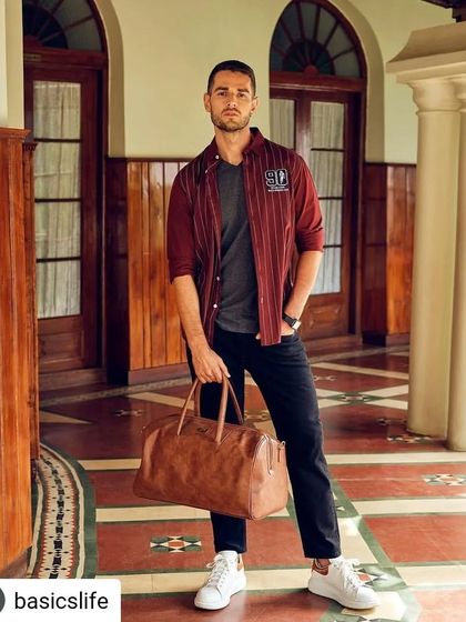 A smart, layered look we put together for the Basics Life campaign. The striped maroon jacket over a grey t-shirt and black trousers creates a polished yet approachable style, perfect for a weekend getaway.