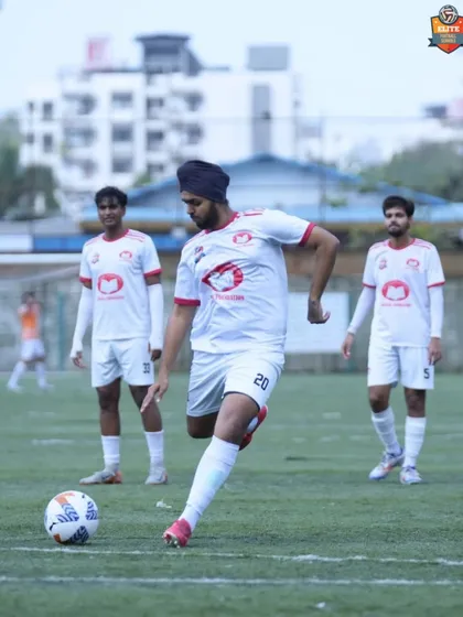 A player prepares to take a free-kick, a moment of precision and control that reflects our team's overall performance.
