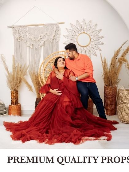 A studio portrait of a couple with a text overlay highlighting the "Premium Quality Props" I use to make every session special.