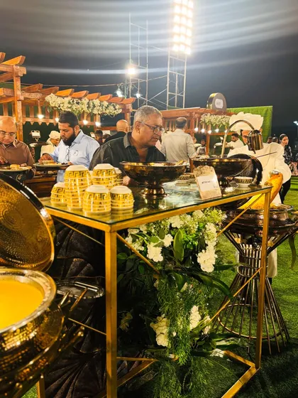 A guest helps himself to the delicious Mutton Mandi, a popular and satisfying main course.