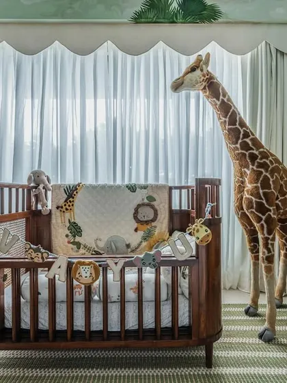 This jungle-themed nursery is one of my favorite projects. I designed this classic wooden crib with natural cane details to be the centerpiece of a room filled with adventure. It’s handcrafted from solid wood and finished to be completely safe for your little one.