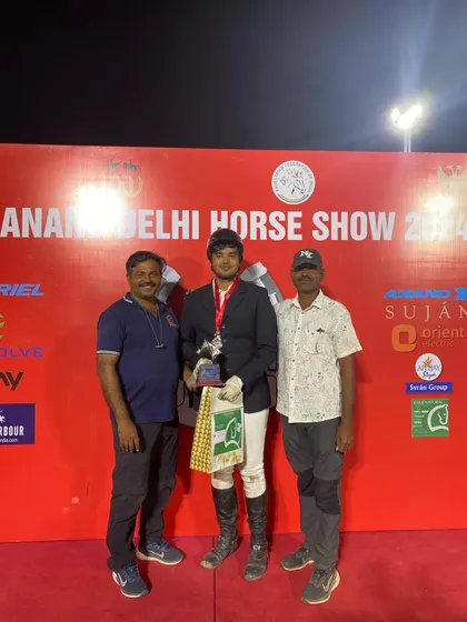Another proud photo of our "Best Young Rider" with his support team. It takes a village, and we are proud of our dedicated team of coaches and grooms.