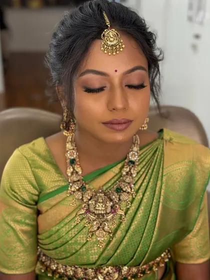 A close-up of Kiruba's final look. The heavy temple necklace is the centerpiece of her engagement attire.