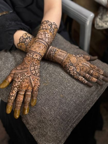 A relaxed pose showing both hands with the full coverage design.