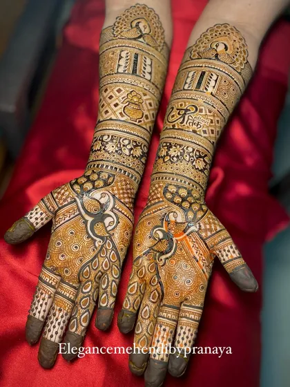 This full-arm bridal mehendi is all about the majestic peacock. I've used different variations of the peacock motif on the palms and forearms for a truly royal feel.