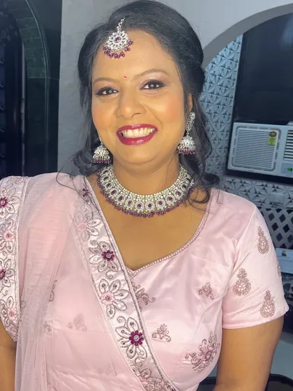 The complete look is radiant and celebratory, perfect for a wedding guest.