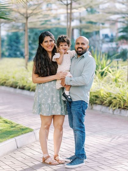 A family portrait on a paved path in a park. A great example of how we can find beautiful spots for photos almost anywhere.