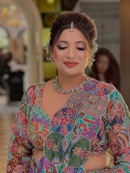 A close-up with eyes closed to showcase the detailed and beautifully blended eyeshadow.