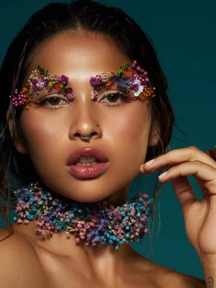 A breathtaking look where delicate pressed flowers are used to create artistic, ethereal eyebrows.