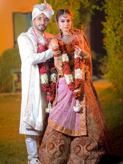 A classic wedding day portrait of the couple in their ceremony attire.