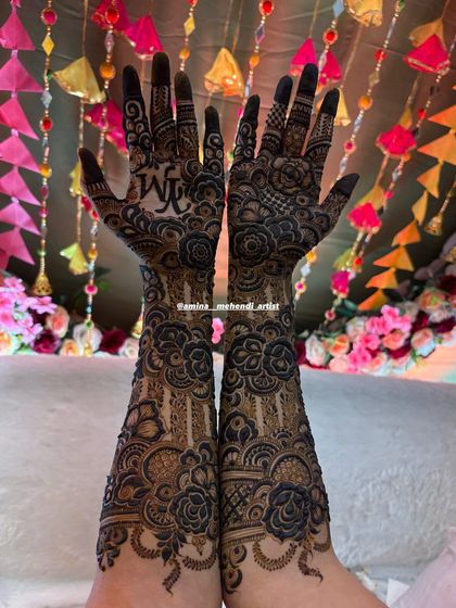This design has a festive feel, with a beautiful background that complements the intricate henna work.