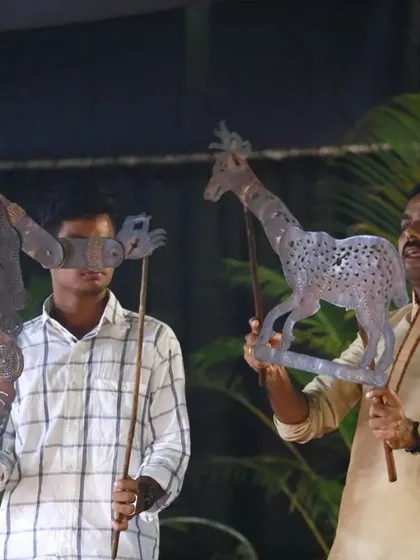 Our performances showcase diverse puppetry forms. Here, artists demonstrate Tholpavakoothu, the art of shadow puppetry from Kerala, where leather puppets are used to narrate stories from the epics against a backlit screen.