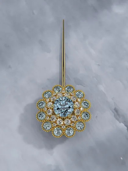 Your presence deserves a piece that rises to meet it. This floral-inspired pin, with its glowing aquamarine center and shimmering layers of diamonds, is crafted to highlight your grace and individuality.