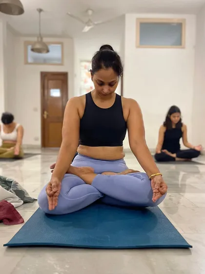 Each practice is a step closer to discovering the power within. This student embodies focus and serenity in Padmasana (Lotus Pose), a testament to the strength and confidence built on the mat.