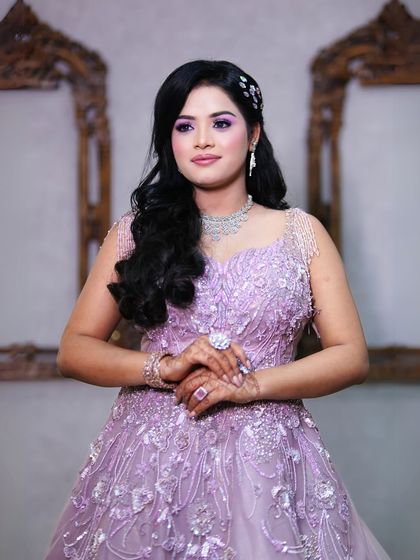 A close-up beauty shot that captures the intricate details of the gown's bodice and the flawless makeup.