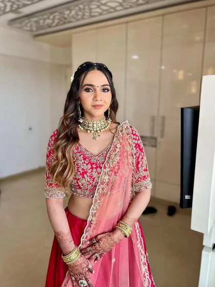 Restyling a wedding outfit for a new event. This guest looks absolutely beautiful with a fresh makeup application and a romantic, floral hairstyle.