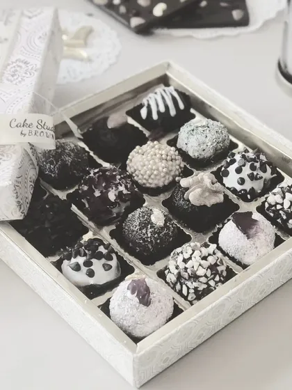 Our black and white themed chocolate truffle box. This elegant silver and white packaging is perfect for sophisticated corporate gifts, filled with a delicious assortment of our handmade truffles.