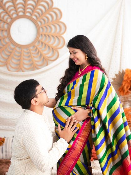 A beautiful example of our boho set used for a traditional maternity shoot. The vibrant colors of the saree pop against the neutral, earthy tones of the backdrop, creating a stunning cultural portrait.