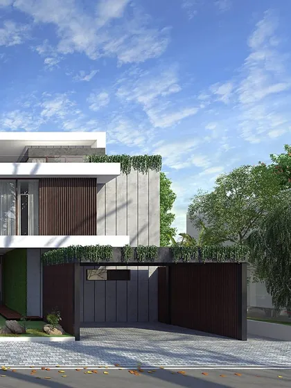 A view of the private entrance and garage for the Epsilon villa, where we integrated planters and green roofing to soften the modern structure.