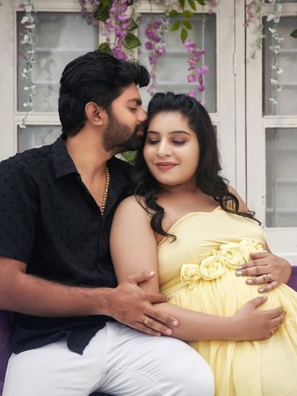 A sweet kiss on the forehead. These are the tender moments we love to capture, celebrating your journey together.