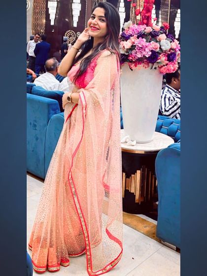 My love for sarees is never-ending. This peach-colored net saree with a simple border is a delicate and graceful choice for a daytime wedding event or a Roka ceremony.