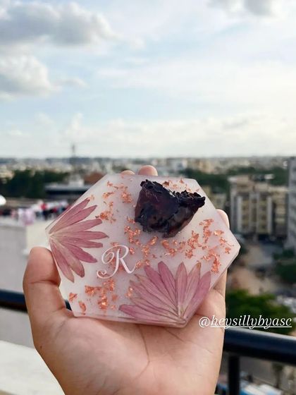 Another view of the initial coaster, showing how the rose gold flakes catch the light. I can customize the flakes to be gold, silver, or rose gold based on your preference.