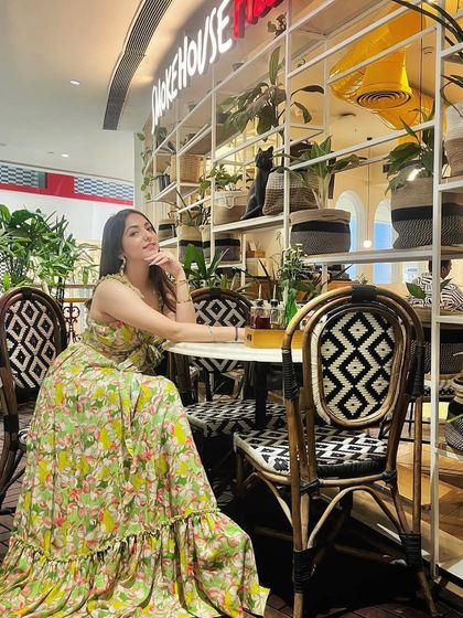 Warning: this dress will turn heads. A confident shot in the floral maxi dress, perfect for a brunch or a day out.