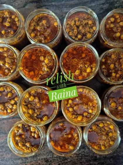 Jars of Chana Kairi pickle, ready to be enjoyed. The combination of the soft, tangy chana and the spicy raw mango masala is truly delicious. I make this flavour every summer for my regular clients who love it.