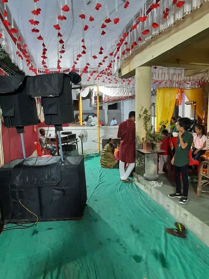 My sound system and lighting rig set up for an outdoor event. The speakers are positioned for optimal sound coverage across the venue.