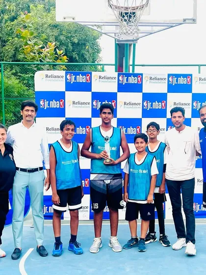 The winning team and coaches at the Jr. NBA Delhi NCR Tournament. This victory was earned through months of dedicated practice and a commitment to teamwork.